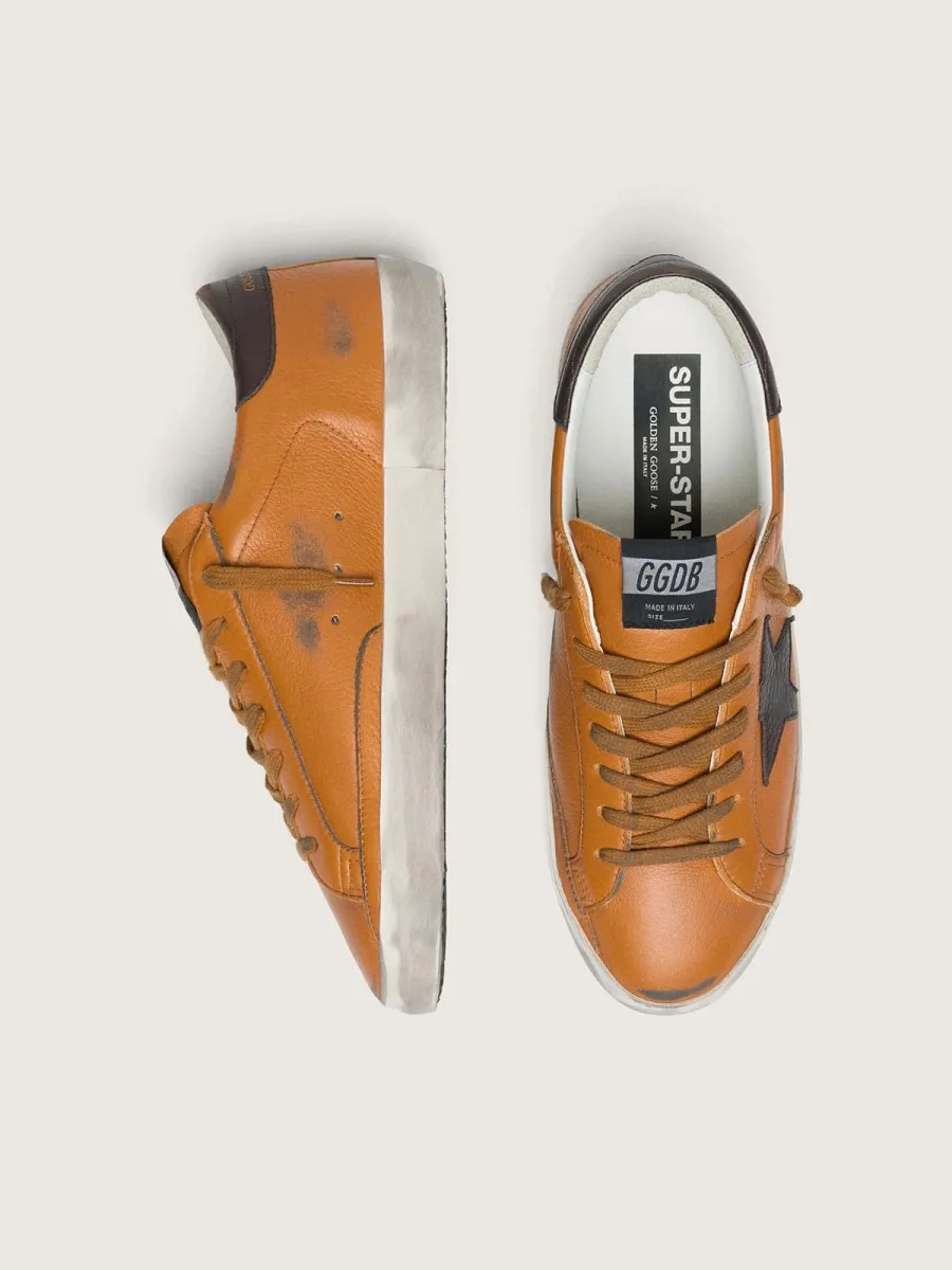 Super-Star LTD uomo in pelle arancione con stella marrone