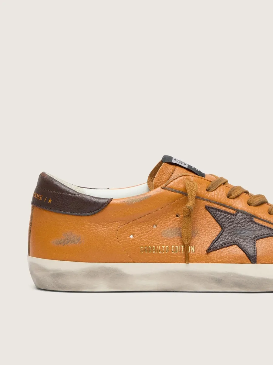 Super-Star LTD uomo in pelle arancione con stella marrone