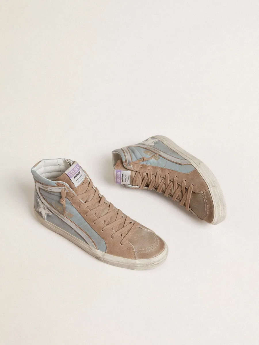 Slide uomo in canvas azzurro con virgola in pelle laminata argento