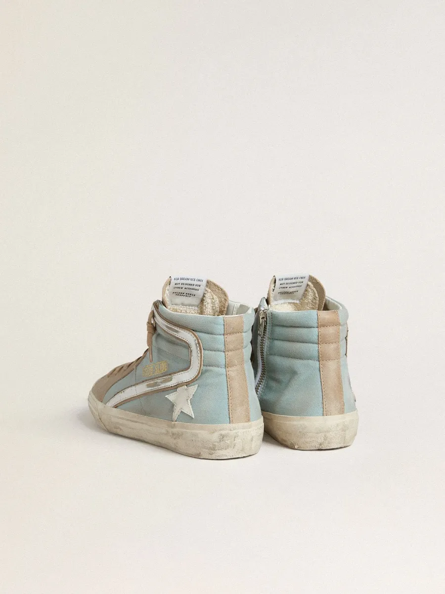 Slide uomo in canvas azzurro con virgola in pelle laminata argento
