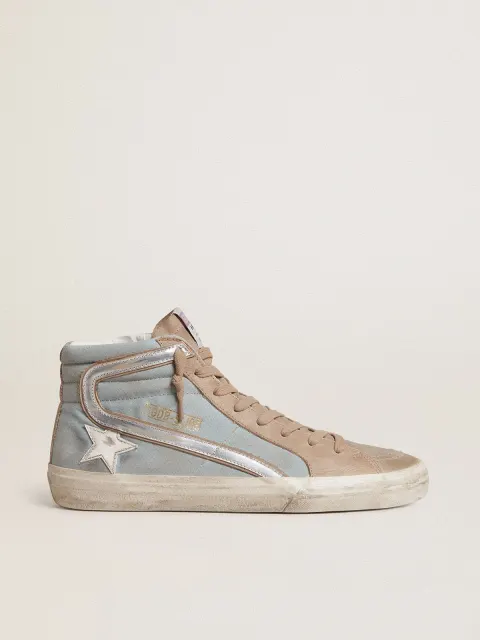 Slide uomo in canvas azzurro con virgola in pelle laminata argento