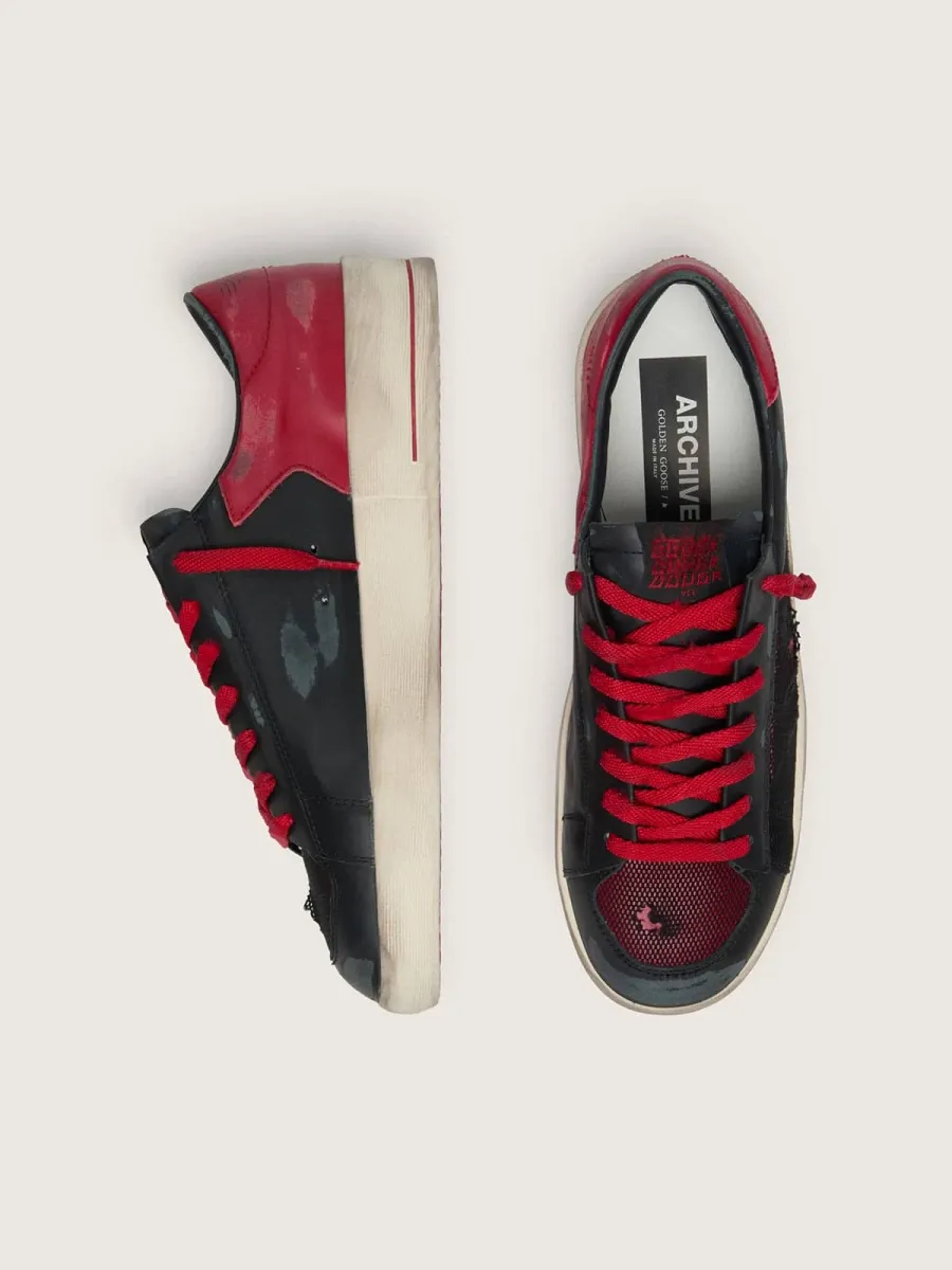 Stardan uomo in pelle nera con stella in pelle rossa inserti in rete nera e pelle rossa