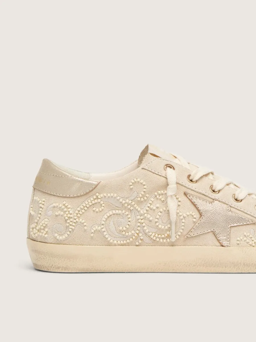 Super-Star LTD donna in suede color perla con stella oro e ricami in perline