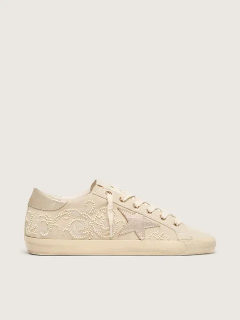 Super-Star LTD donna in suede color perla con stella oro e ricami in perline
