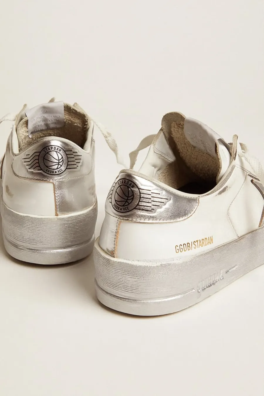 Stardan con stella e talloncino in pelle laminata argento