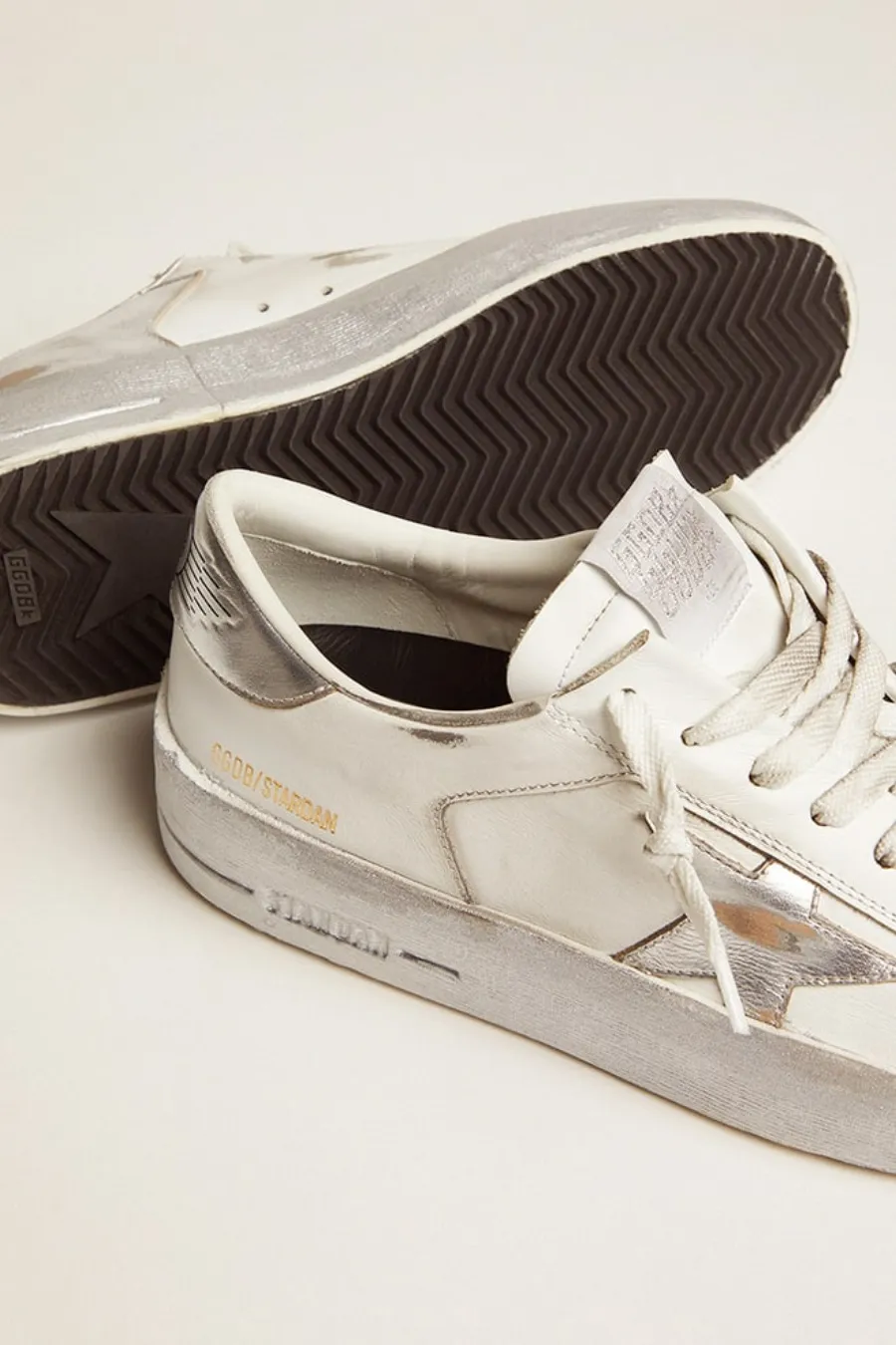 Stardan con stella e talloncino in pelle laminata argento