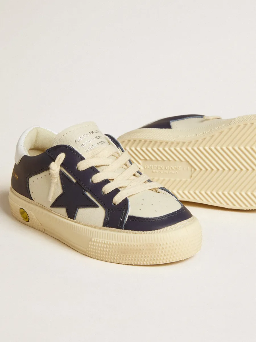 May Young in pelle bianca e blu con stella e talloncino in pelle